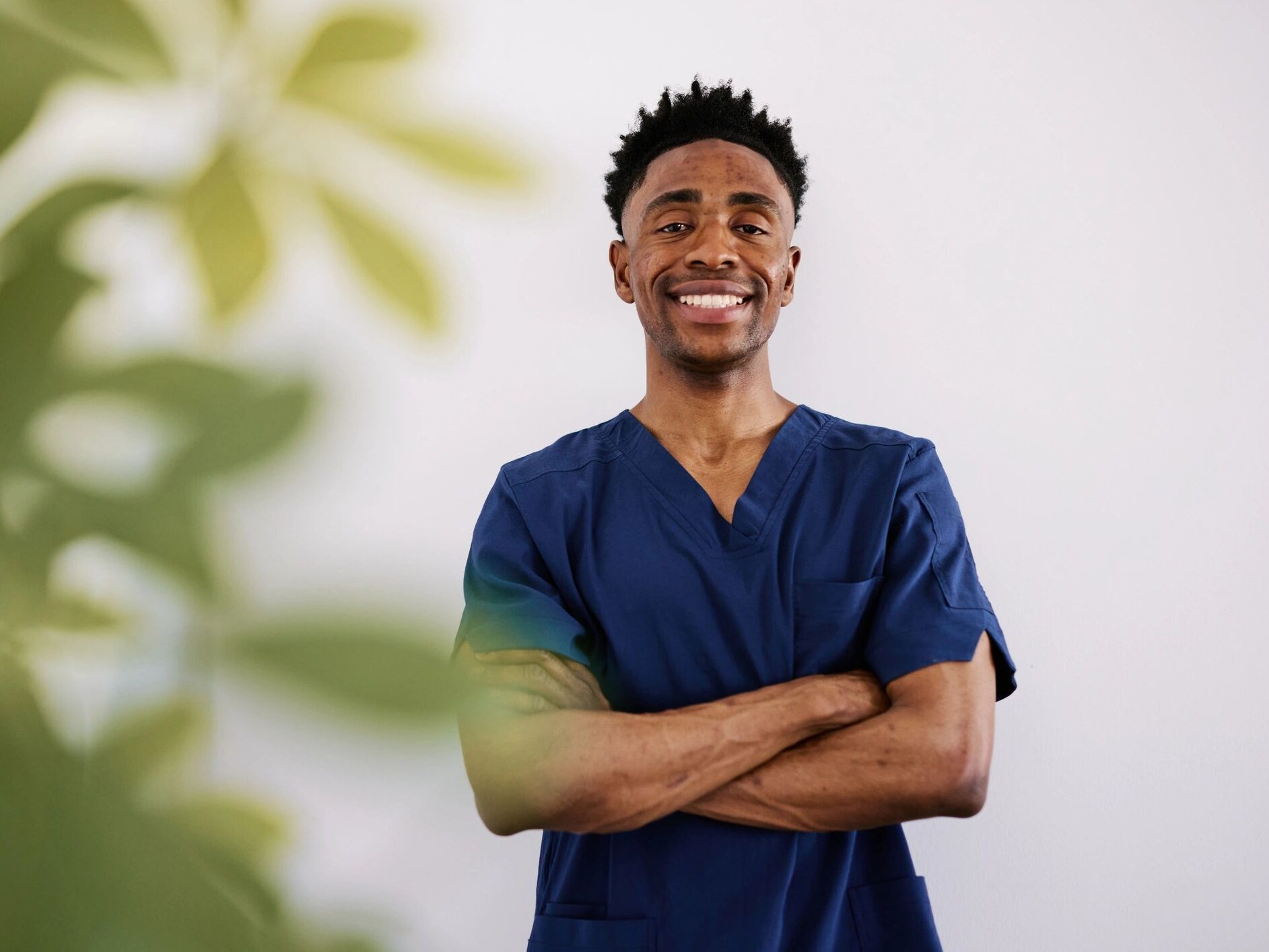 Confident Black Male Healthcare Worker in Blue Scrubs