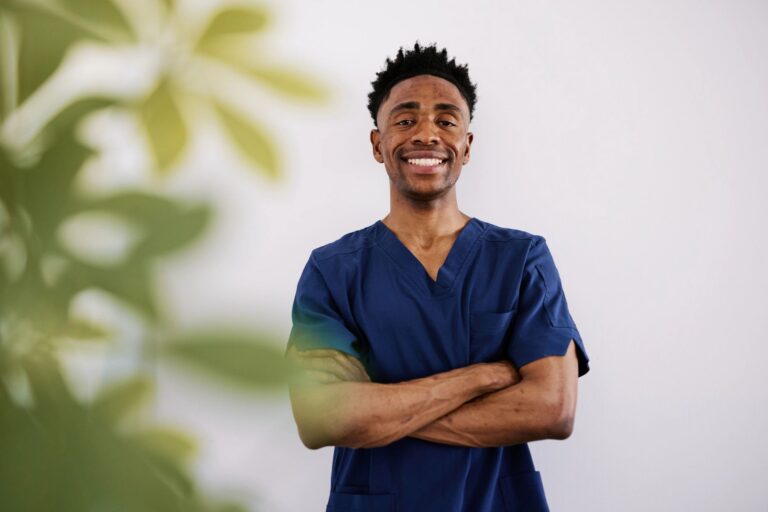 Confident Black Male Healthcare Worker in Blue Scrubs