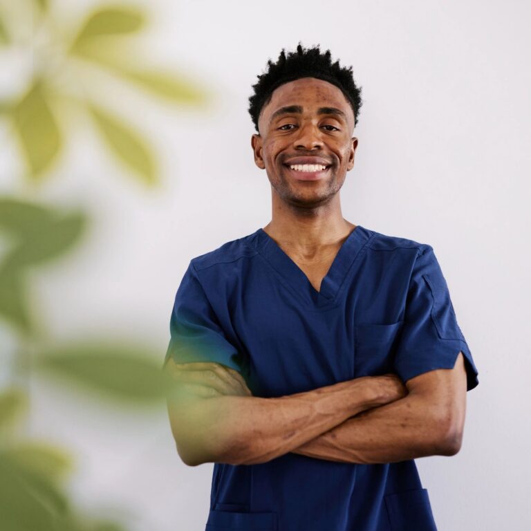 Confident Black Male Healthcare Worker in Blue Scrubs